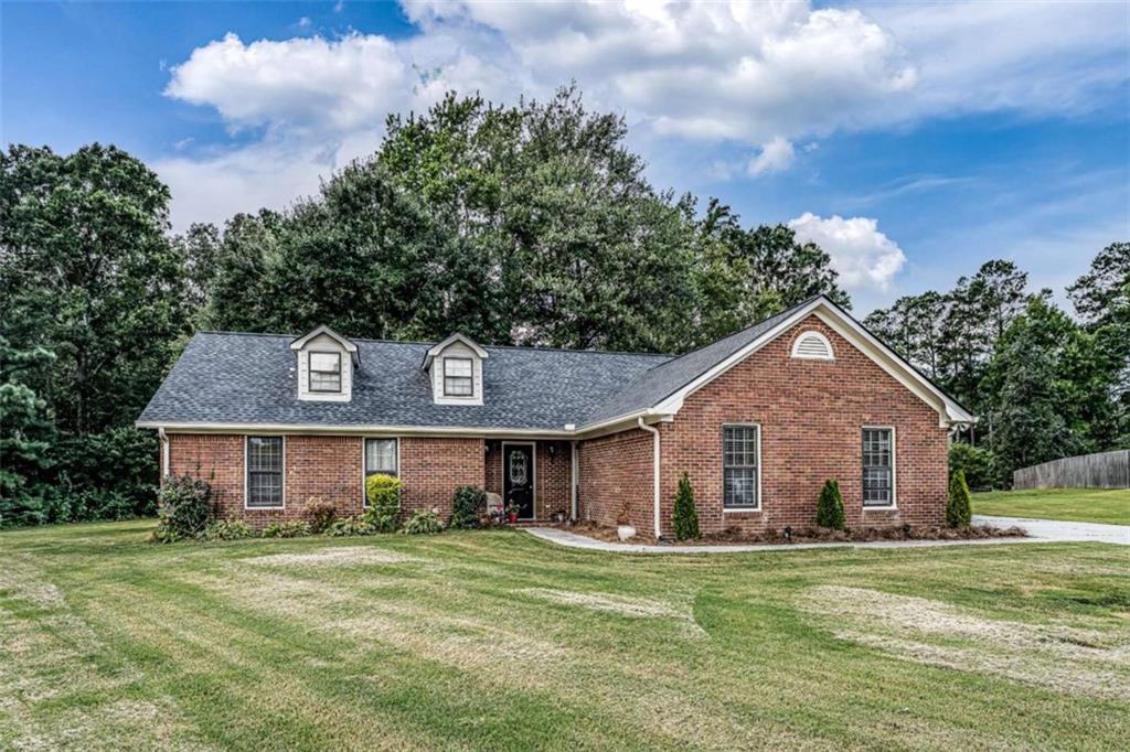 45 Ashley Oaks Trail Northwest Rome, GA 30165 - Photo 1 of 1 a front view of a house with a garden