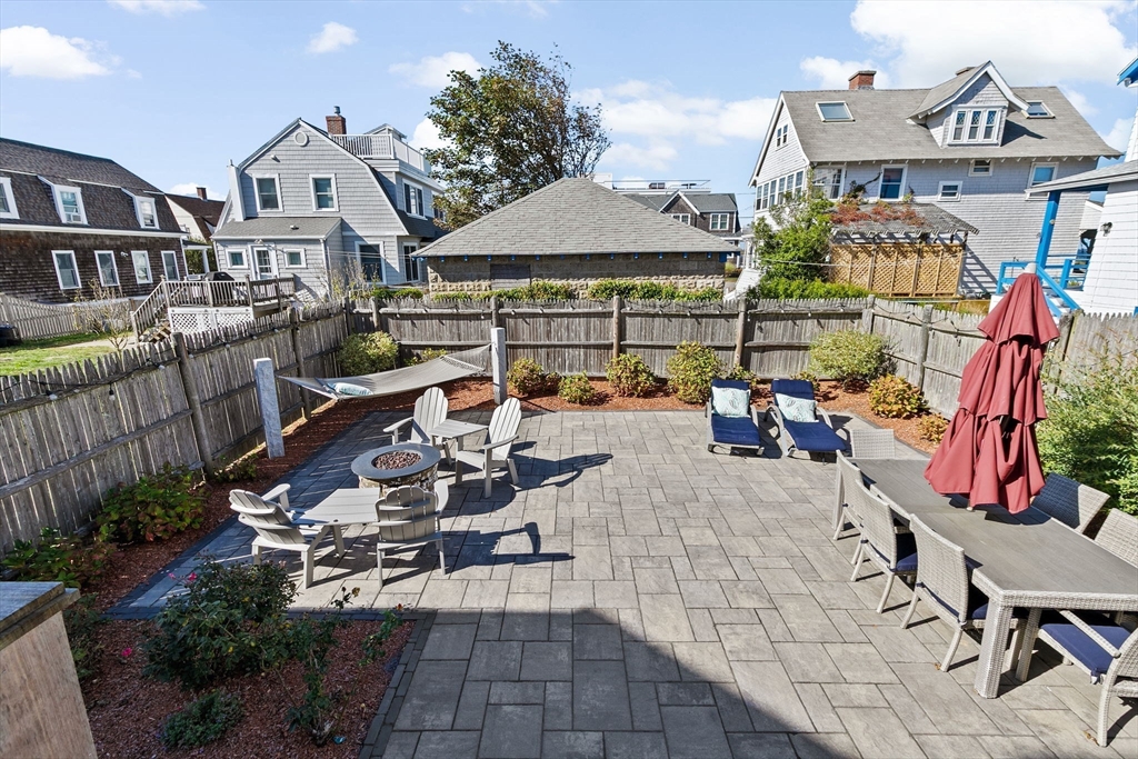 79 F Street Hull, MA 02045 - Photo 11 of 42 a view of a chairs and table in the patio