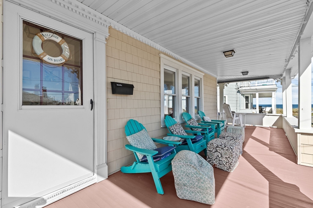 79 F Street Hull, MA 02045 - Photo 12 of 42 a view of a dining room with furniture and a potted plant