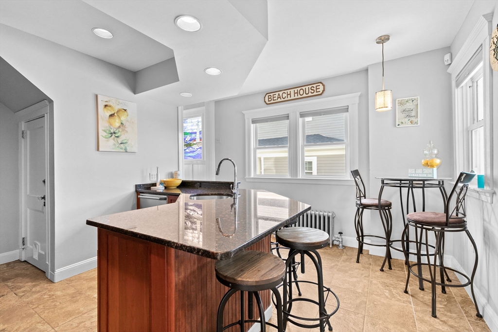 79 F Street Hull, MA 02045 - Photo 21 of 42 a view of a dining room with furniture and a window