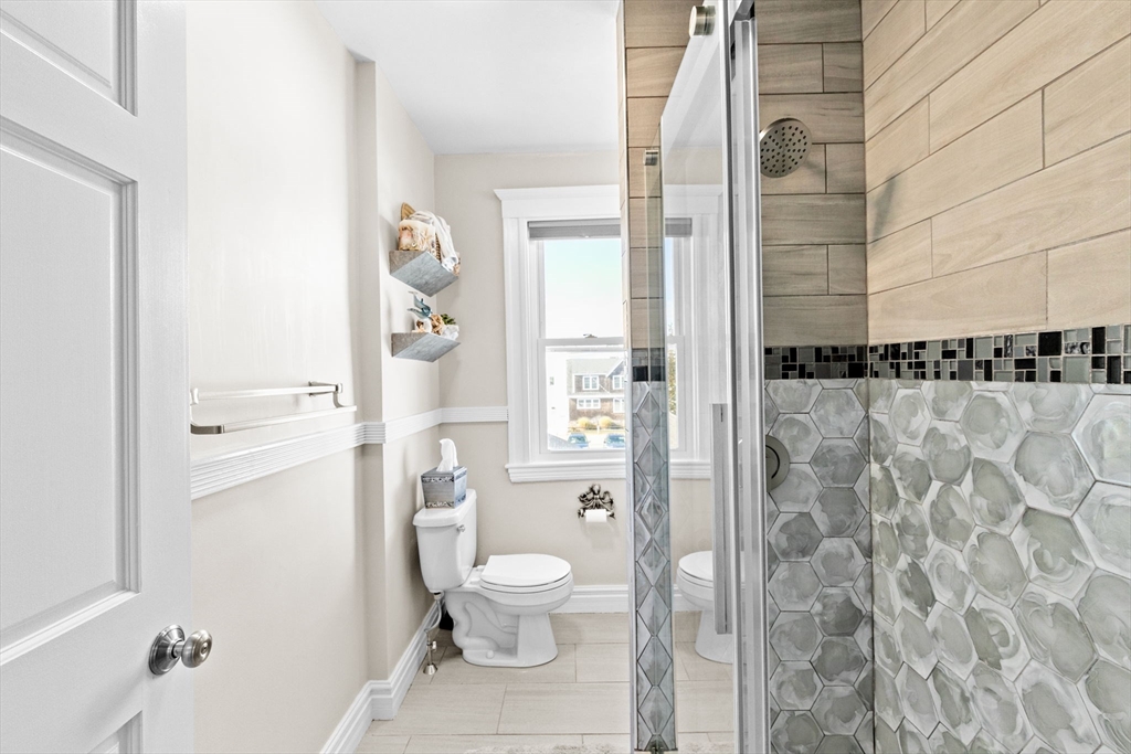 79 F Street Hull, MA 02045 - Photo 25 of 42 a bathroom with a toilet and a shower