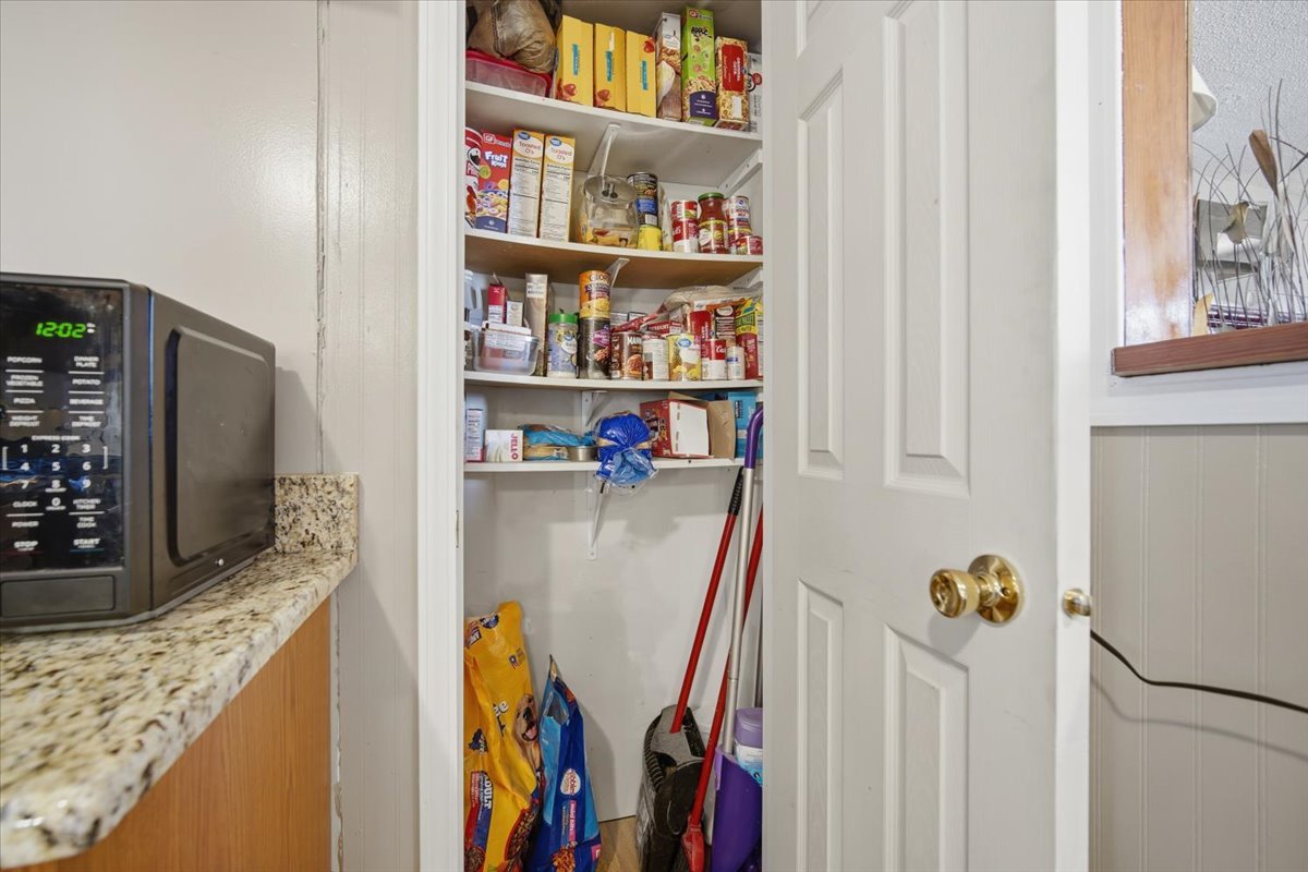 118 Florida Avenue Washington, IL 61571 - Photo 11 of 23 a view of walk in closet with clothes and shoes