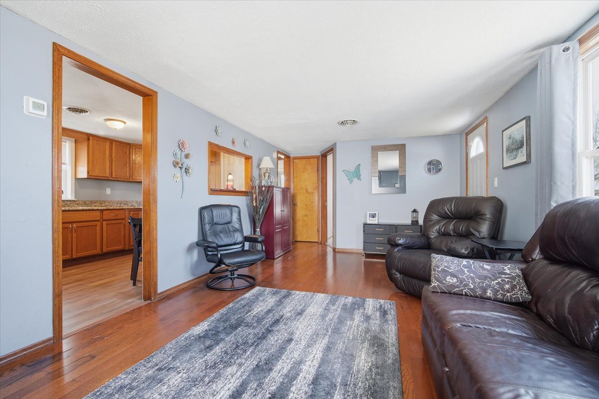 118 Florida Avenue Washington, IL 61571 - Photo 5 of 23 a living room with furniture and a wooden floor