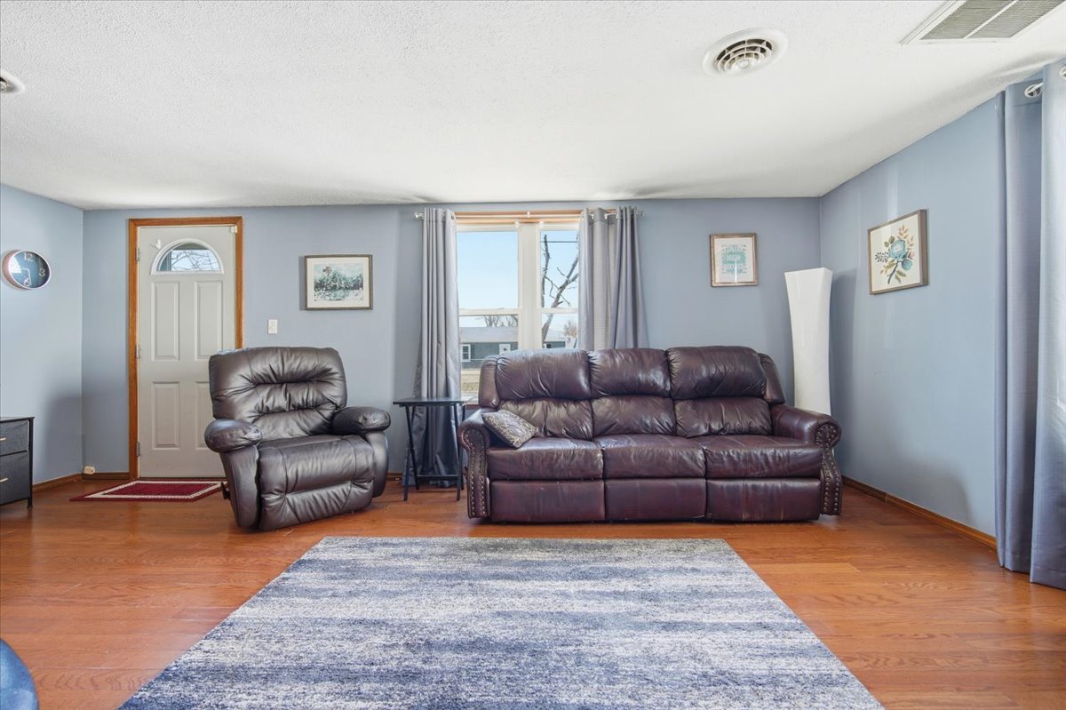 118 Florida Avenue Washington, IL 61571 - Photo 6 of 23 a living room with a couch and a window
