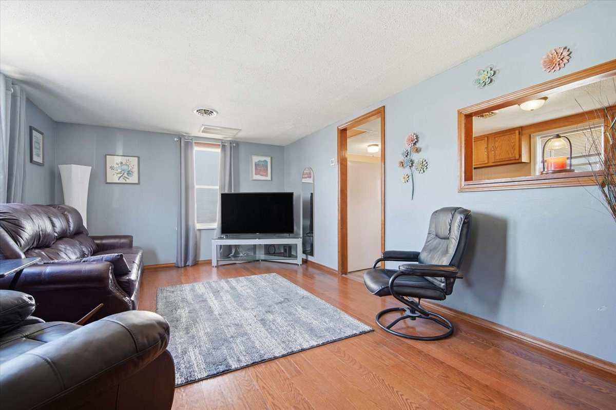 118 Florida Avenue Washington, IL 61571 - Photo 7 of 23 a living room with furniture and a flat screen tv