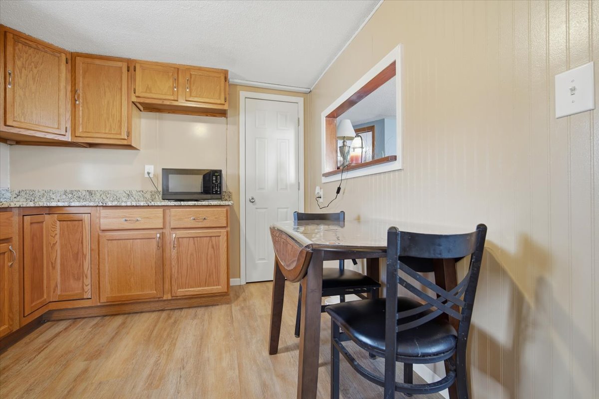 118 Florida Avenue Washington, IL 61571 - Photo 10 of 23 a view of kitchen with cabinets and wooden floor