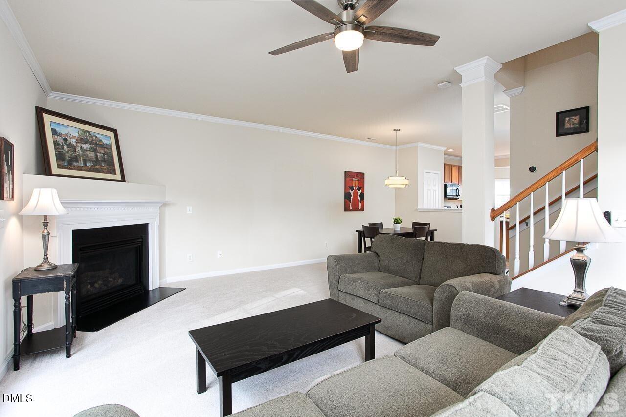 1662 Snow Mass Way Durham, NC 27713 - Photo 11 of 24 a living room with furniture and a fireplace