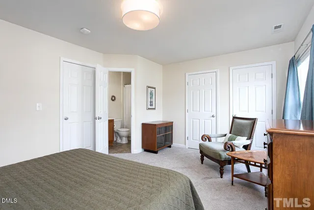 a bedroom with a bed and furniture