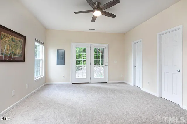 a view of livingroom with window ceiling fan and windows