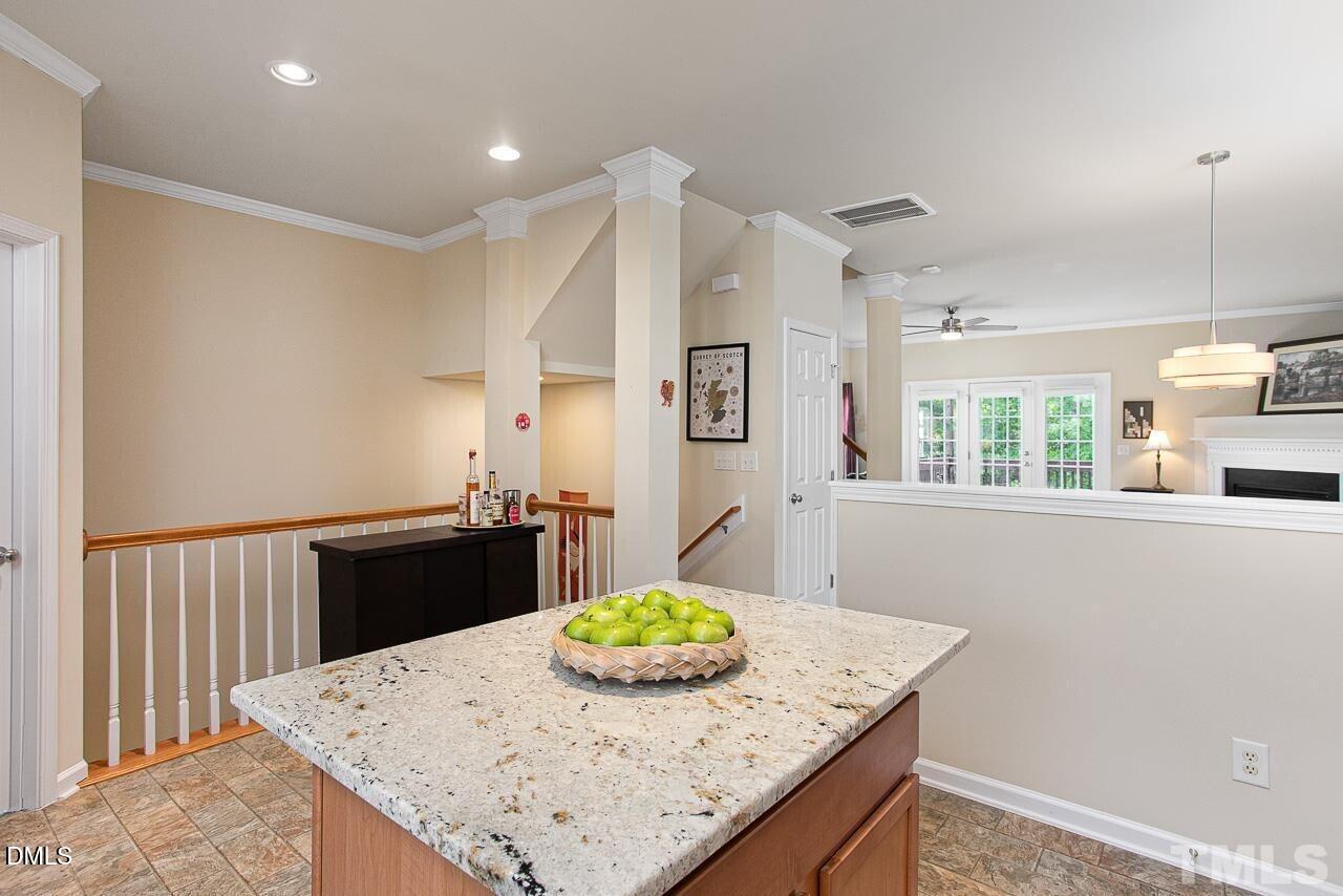 1662 Snow Mass Way Durham, NC 27713 - Photo 6 of 24 a kitchen with granite countertop sink and granite counter tops