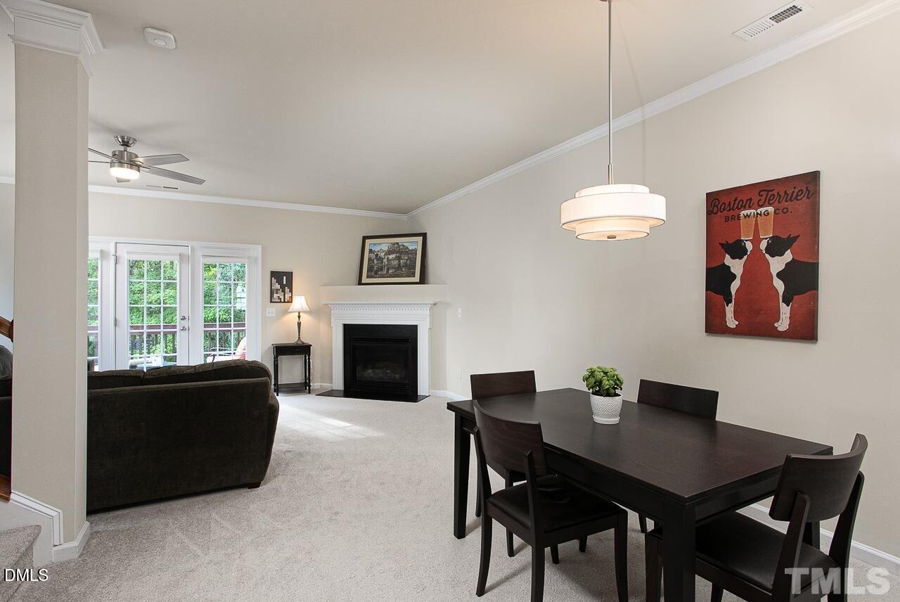 1662 Snow Mass Way Durham, NC 27713 - Photo 8 of 24 a living room with furniture a table and a fireplace