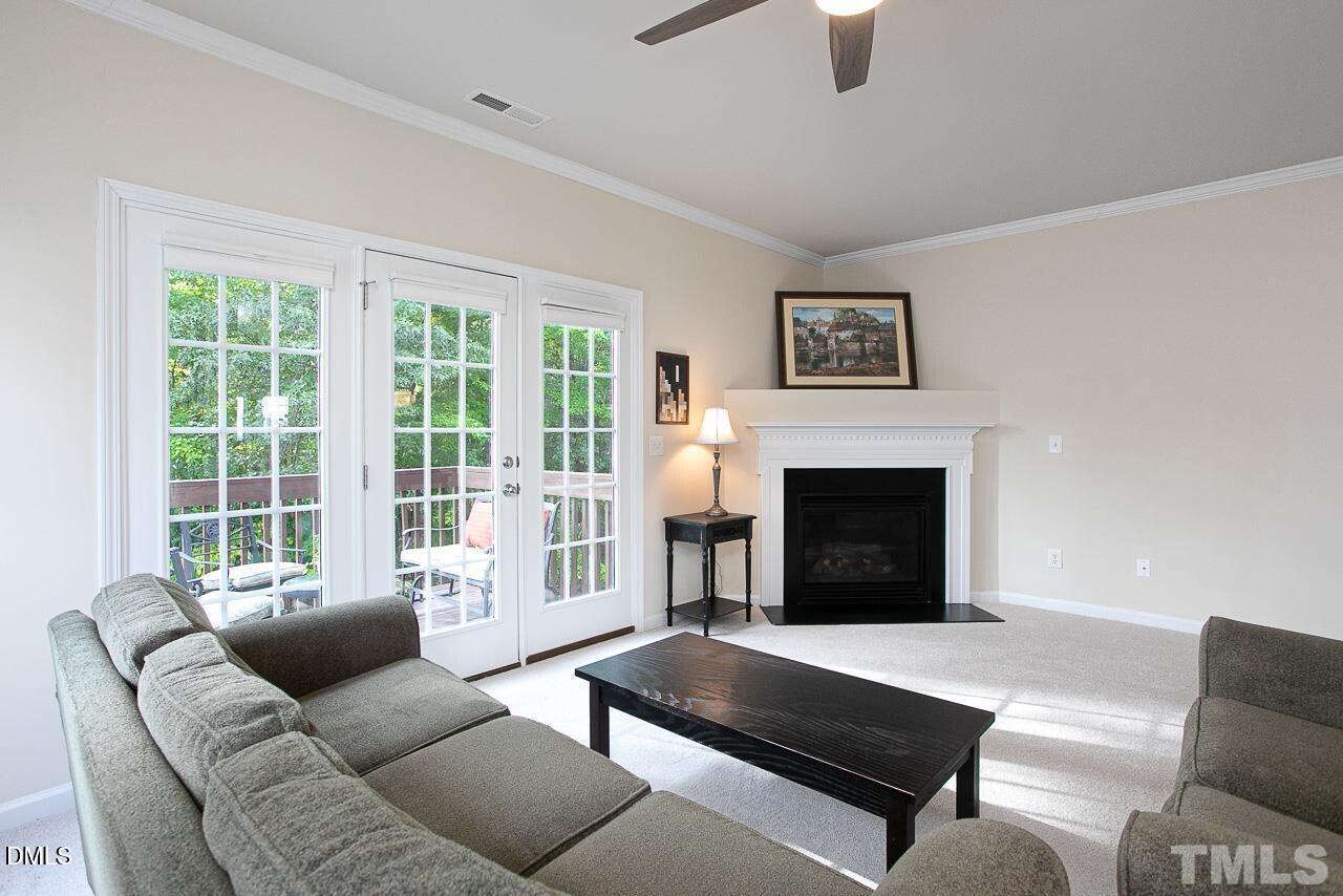 1662 Snow Mass Way Durham, NC 27713 - Photo 10 of 24 a living room with furniture window and a fireplace