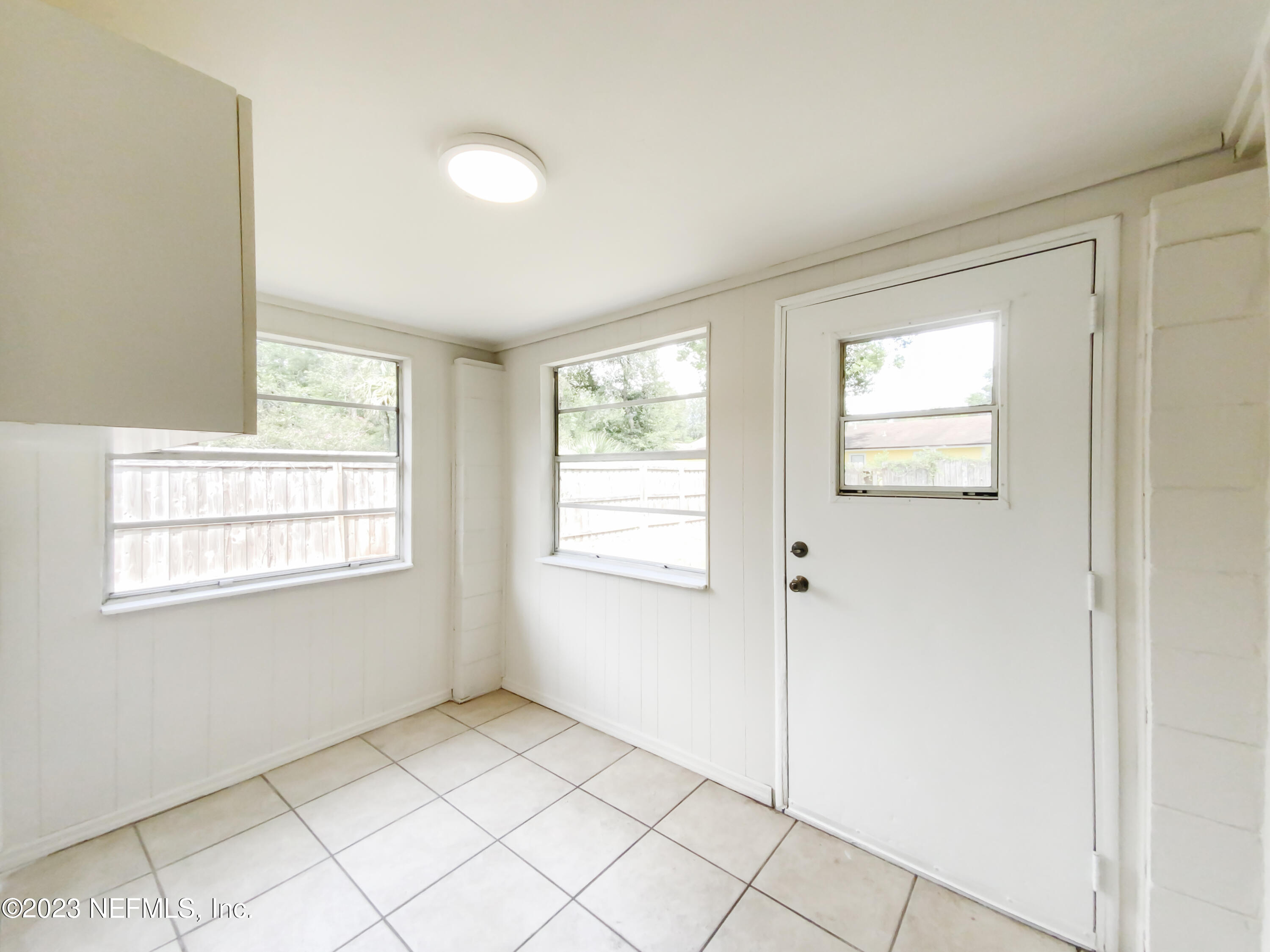6231 Commodore Drive Jacksonville, FL 32244 - Photo 12 of 18 a view of an empty room with window