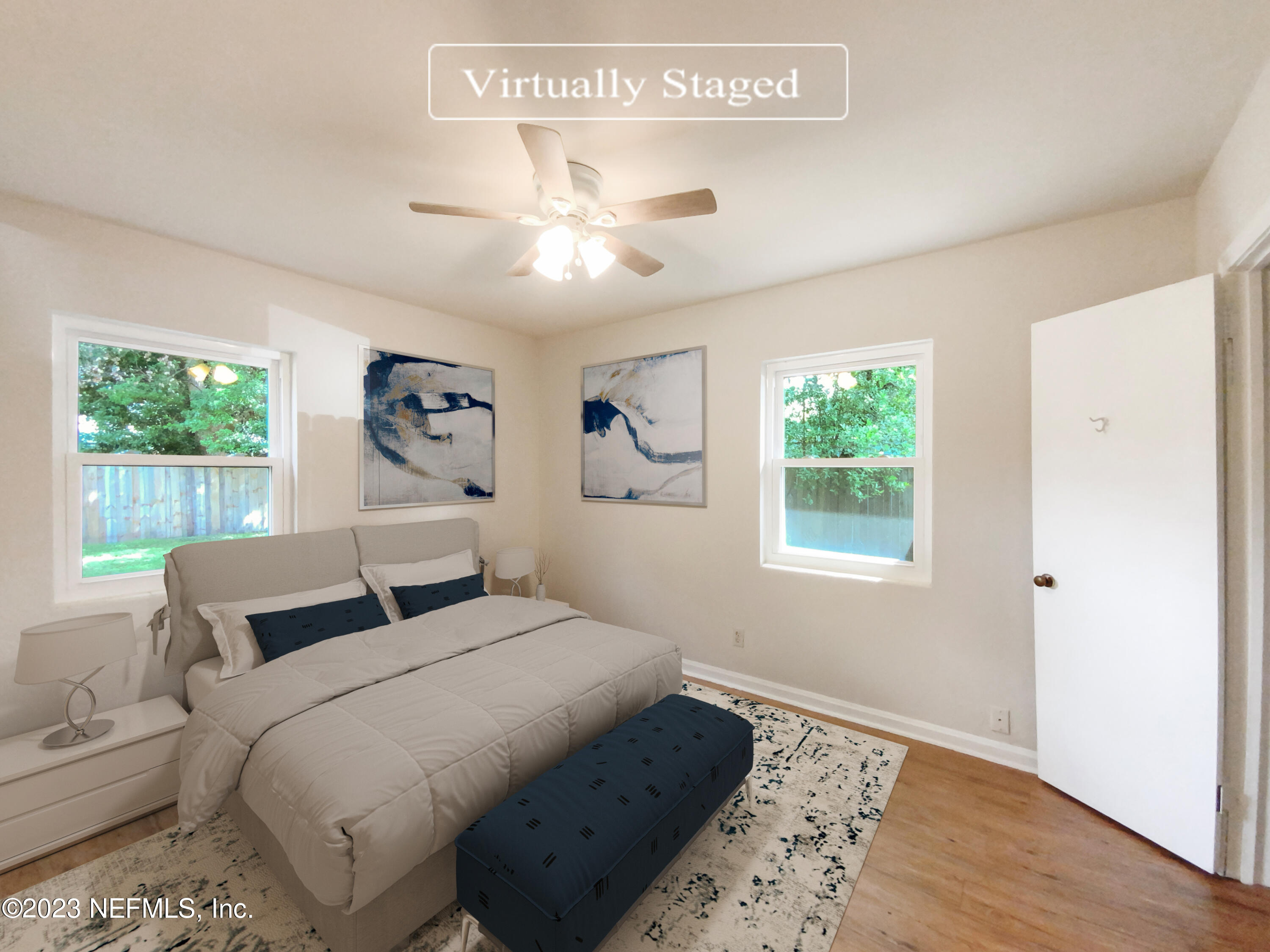 6231 Commodore Drive Jacksonville, FL 32244 - Photo 4 of 18 a bedroom with a large bed and a window