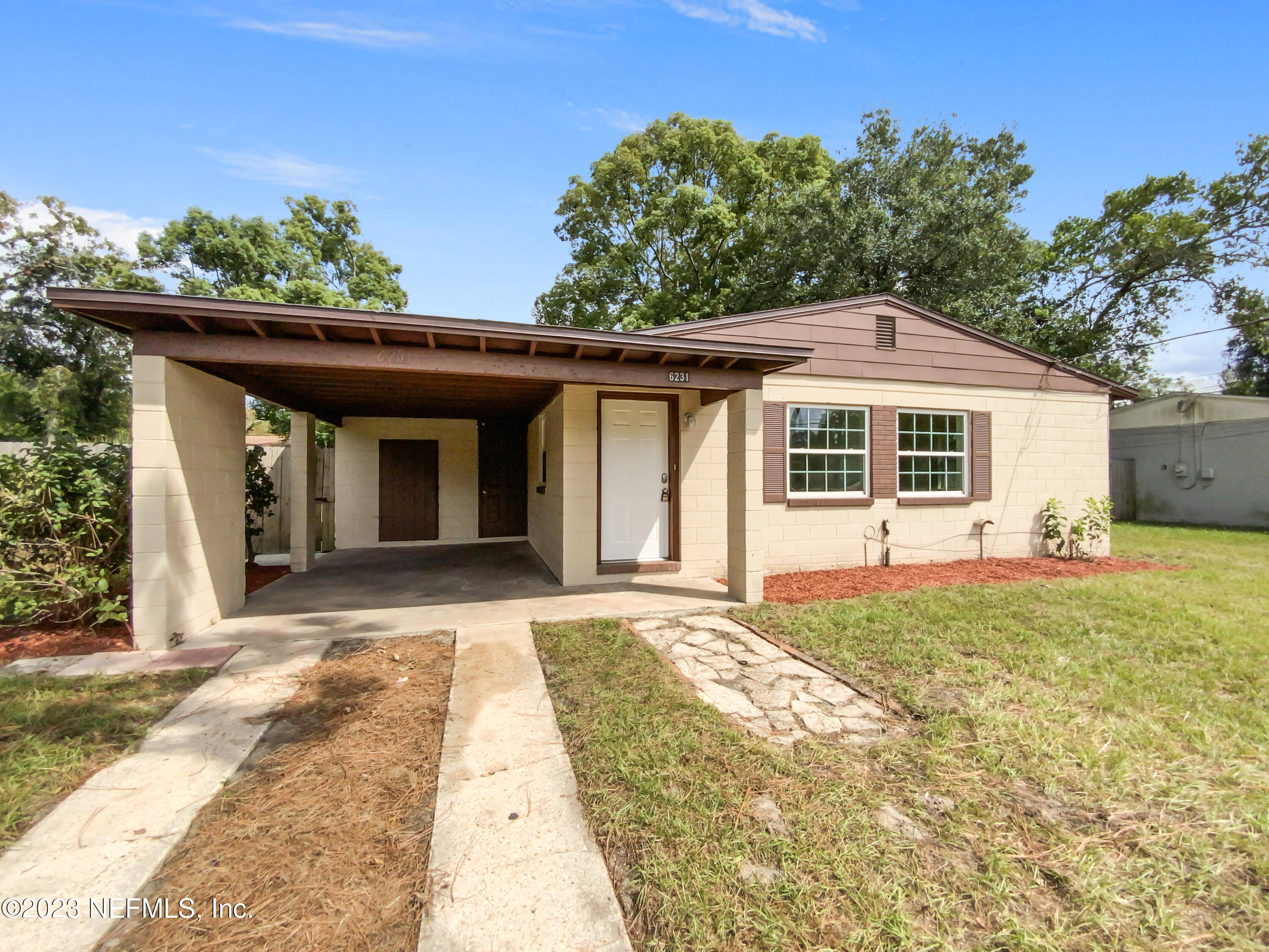 6231 Commodore Drive Jacksonville, FL 32244 - Photo 7 of 18 a front view of a house with a porch