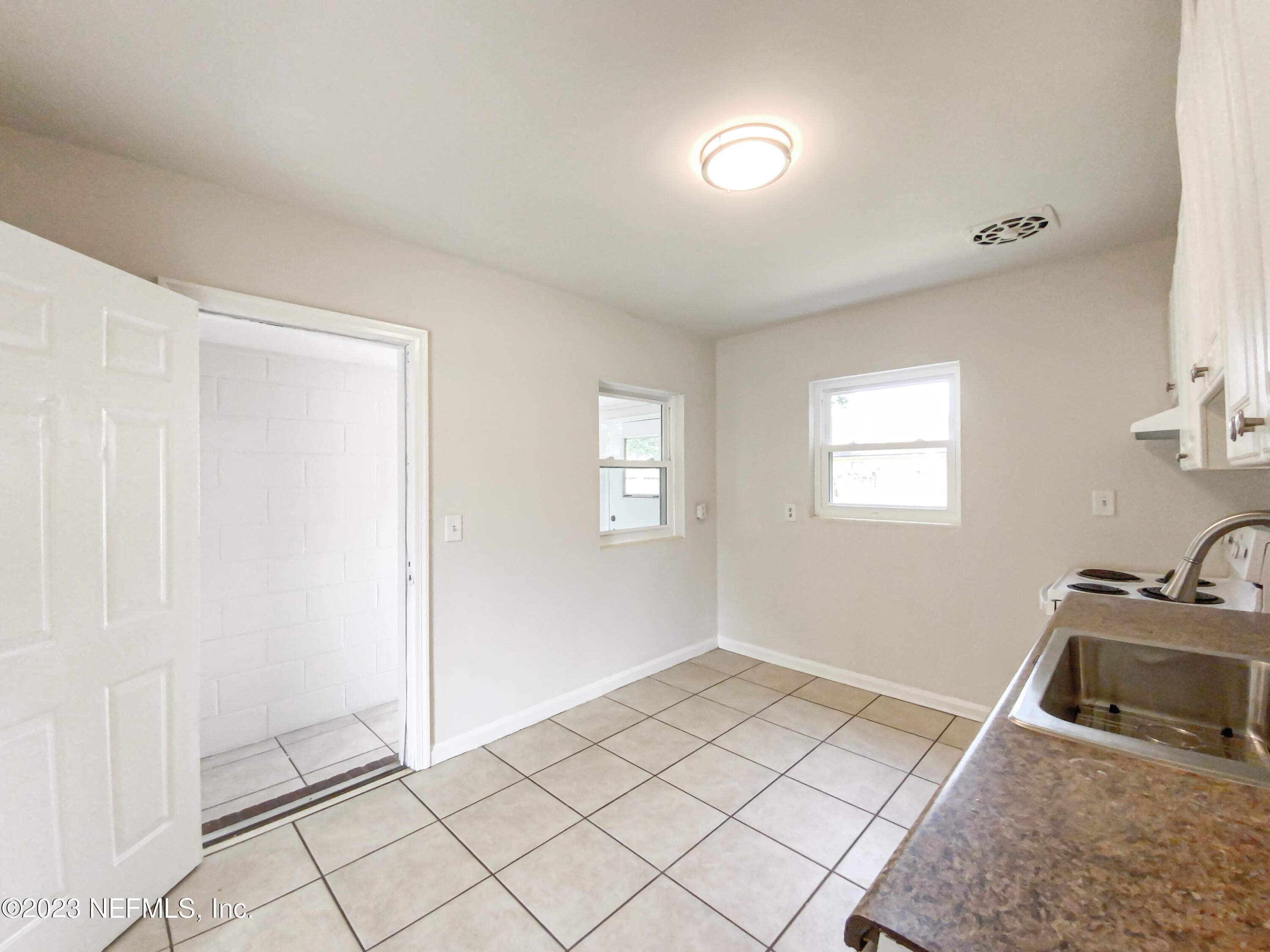 6231 Commodore Drive Jacksonville, FL 32244 - Photo 10 of 18 a view of a room that has a sink and workspace