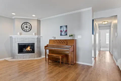 a view of a livingroom with a fireplace and cabinet