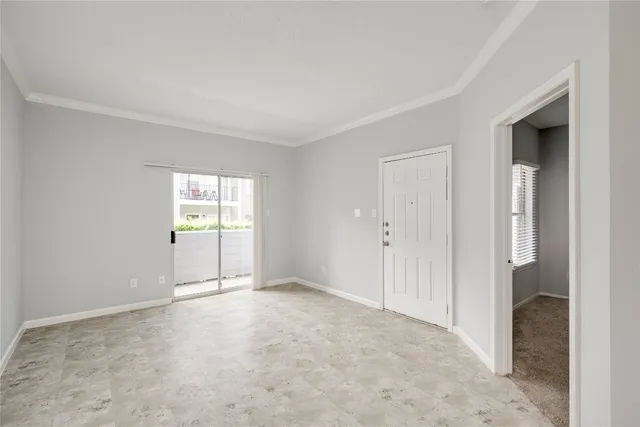 a view of an empty room and window