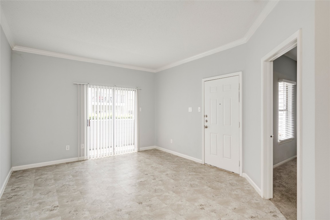 12166 Metric Boulevard, Unit 129 Austin, TX 78758 - Photo 26 of 38 Unfurnished room featuring ornamental molding