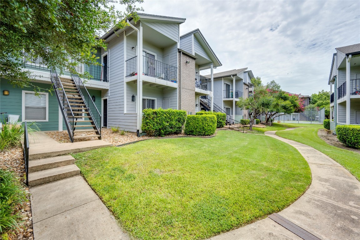12166 Metric Boulevard, Unit 129 Austin, TX 78758 - Photo 7 of 38 View of property featuring stairs