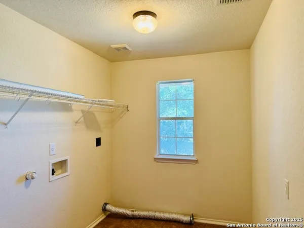 a bathroom with a window and a shower