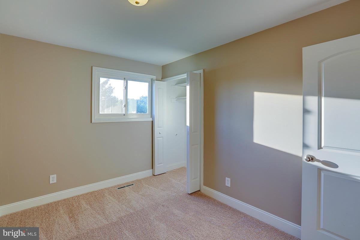 1533 Weyburn Road Baltimore, MD 21237 - Photo 12 of 30 a view of an empty room with a window
