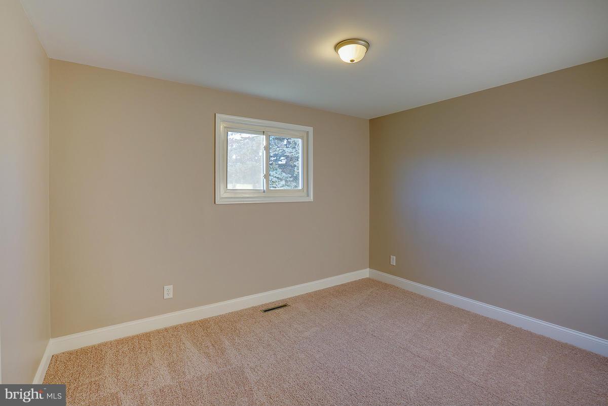 1533 Weyburn Road Baltimore, MD 21237 - Photo 14 of 30 an empty room with a empty space and window