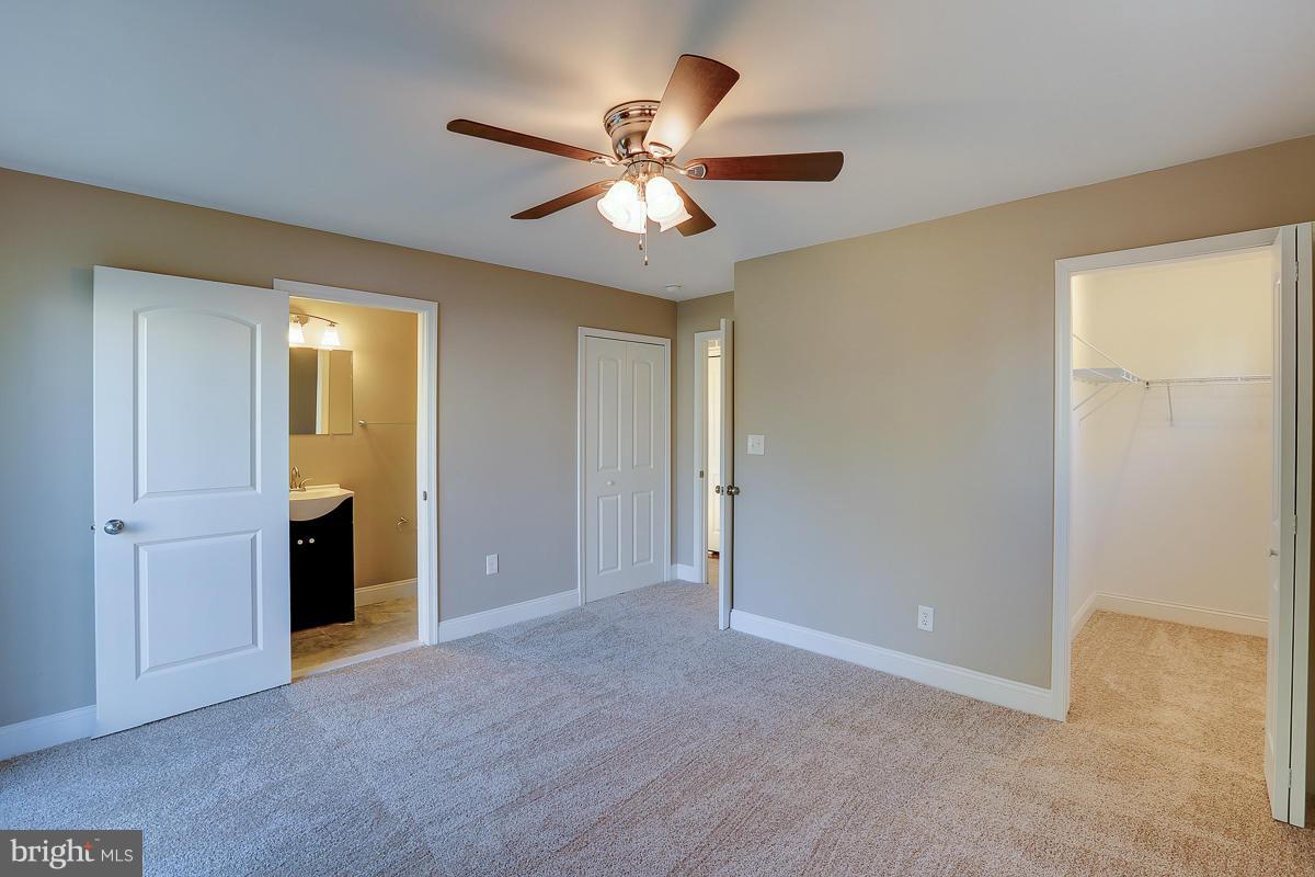 1533 Weyburn Road Baltimore, MD 21237 - Photo 17 of 30 a view of an empty room with a ceiling fan
