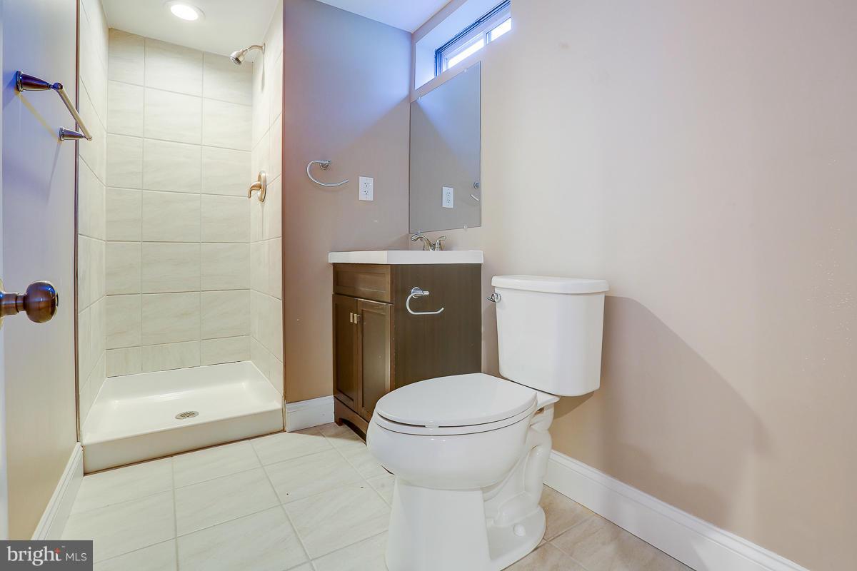 1533 Weyburn Road Baltimore, MD 21237 - Photo 26 of 30 a bathroom with a toilet and a shower