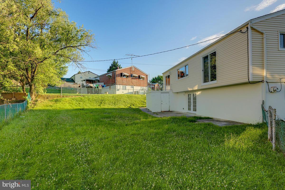 1533 Weyburn Road Baltimore, MD 21237 - Photo 29 of 30 a front view of house with yard and green space