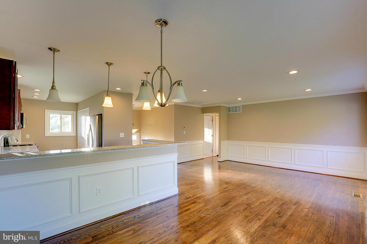 1533 Weyburn Road Baltimore, MD 21237 - Photo 7 of 30 a view of a kitchen with a sink and wooden floor