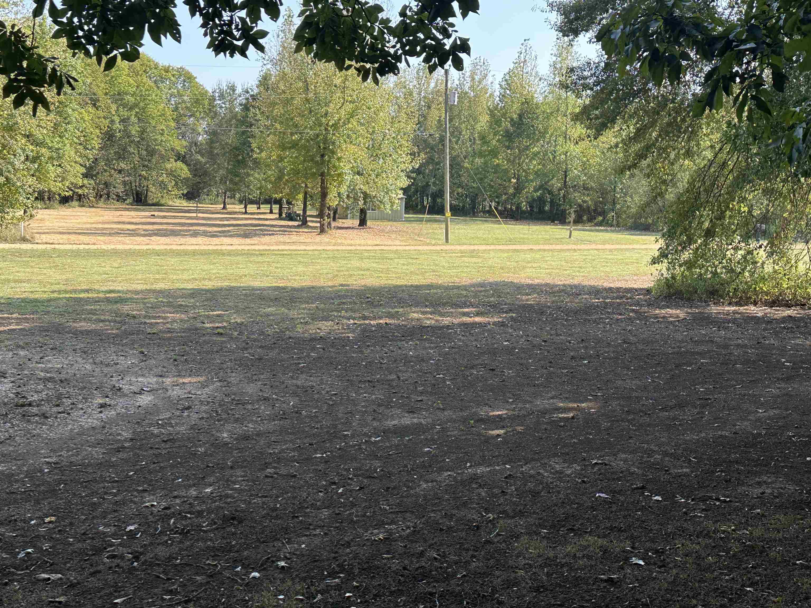 780 Towboat Lane Adamsville, TN 38310 - Photo 3 of 12 a view of a swimming pool with an outdoor space and seating area