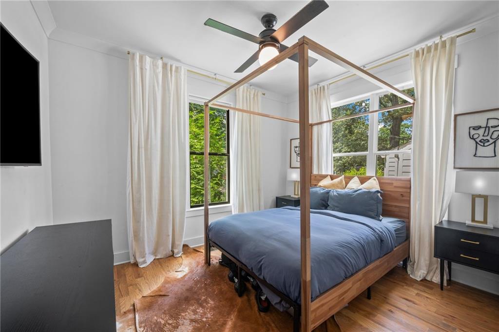 1058 Sanders Avenue Southeast Atlanta, GA 30316 - Photo 12 of 55 a bedroom with a bed and a flat tv screen on dresser