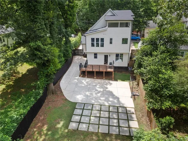 a bedroom with furniture window and a ceiling fan