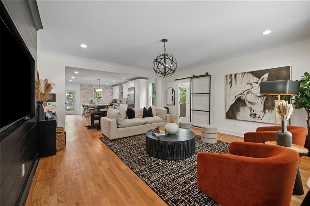 1058 Sanders Avenue Southeast Atlanta, GA 30316 - Photo 22 of 55 a living room with furniture a rug and a flat screen tv
