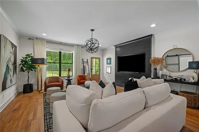 a living room with fireplace furniture and a flat screen tv