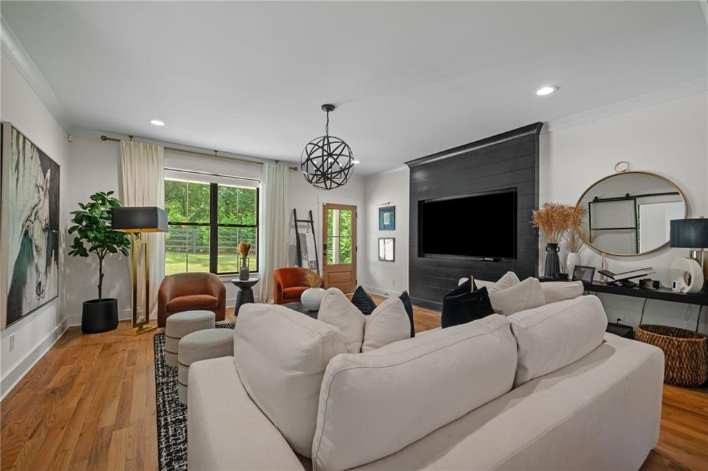 1058 Sanders Avenue Southeast Atlanta, GA 30316 - Photo 29 of 55 a living room with furniture fireplace and flat screen tv