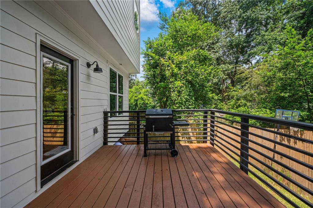 1058 Sanders Avenue Southeast Atlanta, GA 30316 - Photo 9 of 55 a view of balcony and deck with wooden floor and fence