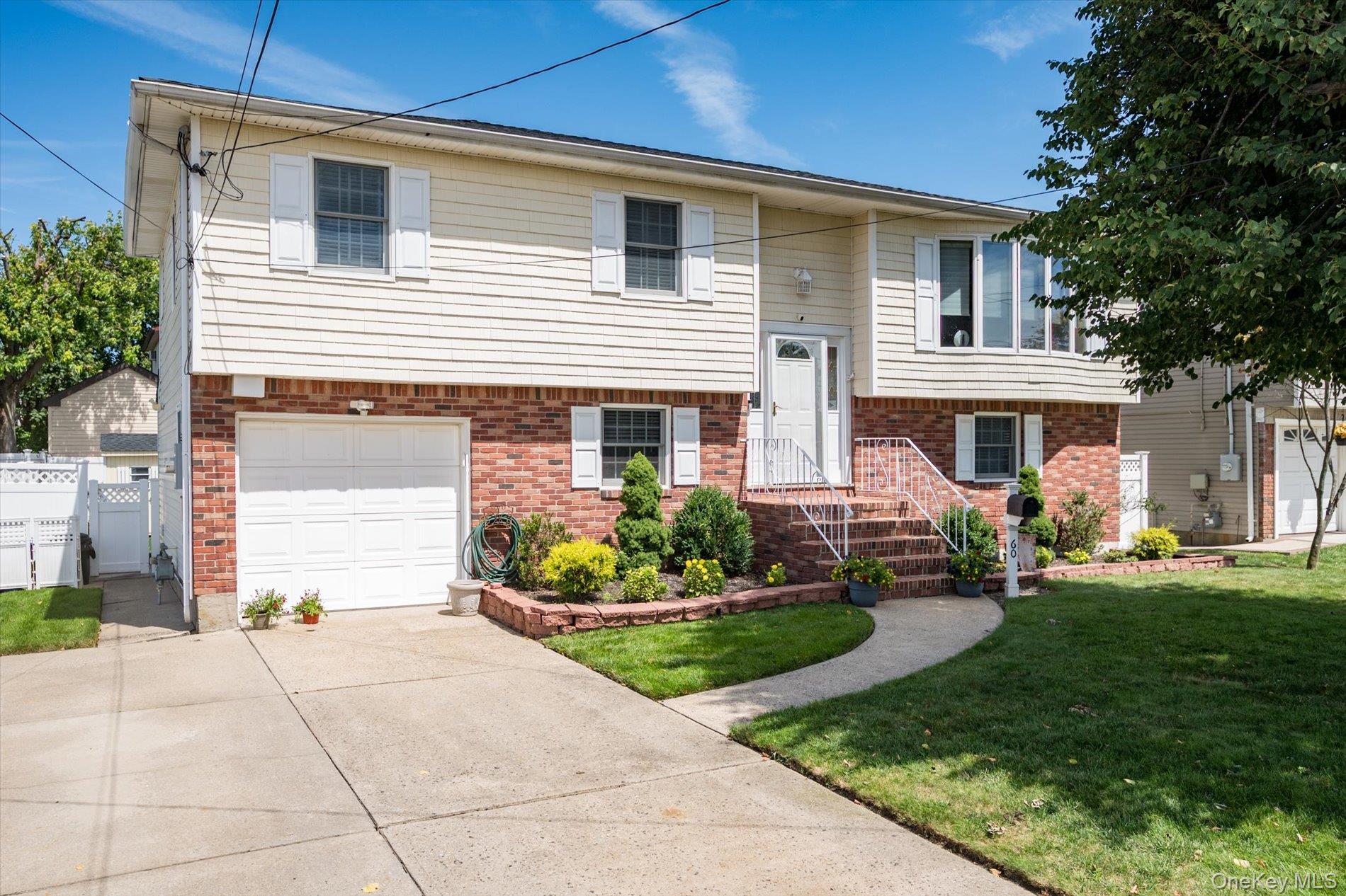 a front view of a house with a yard and outdoor seating