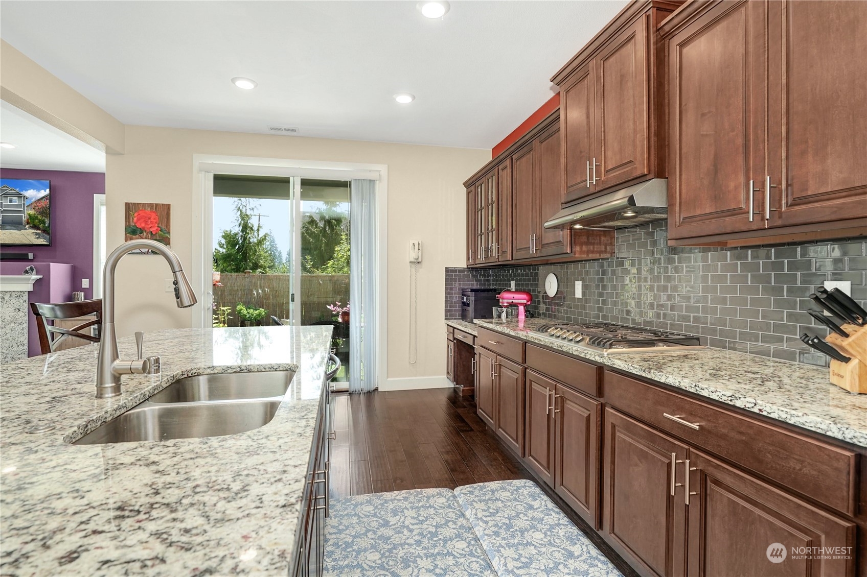 4012 174th Street Southeast Bothell, WA 98012 - Photo 13 of 36 a kitchen with stainless steel appliances granite countertop a sink stove and cabinets