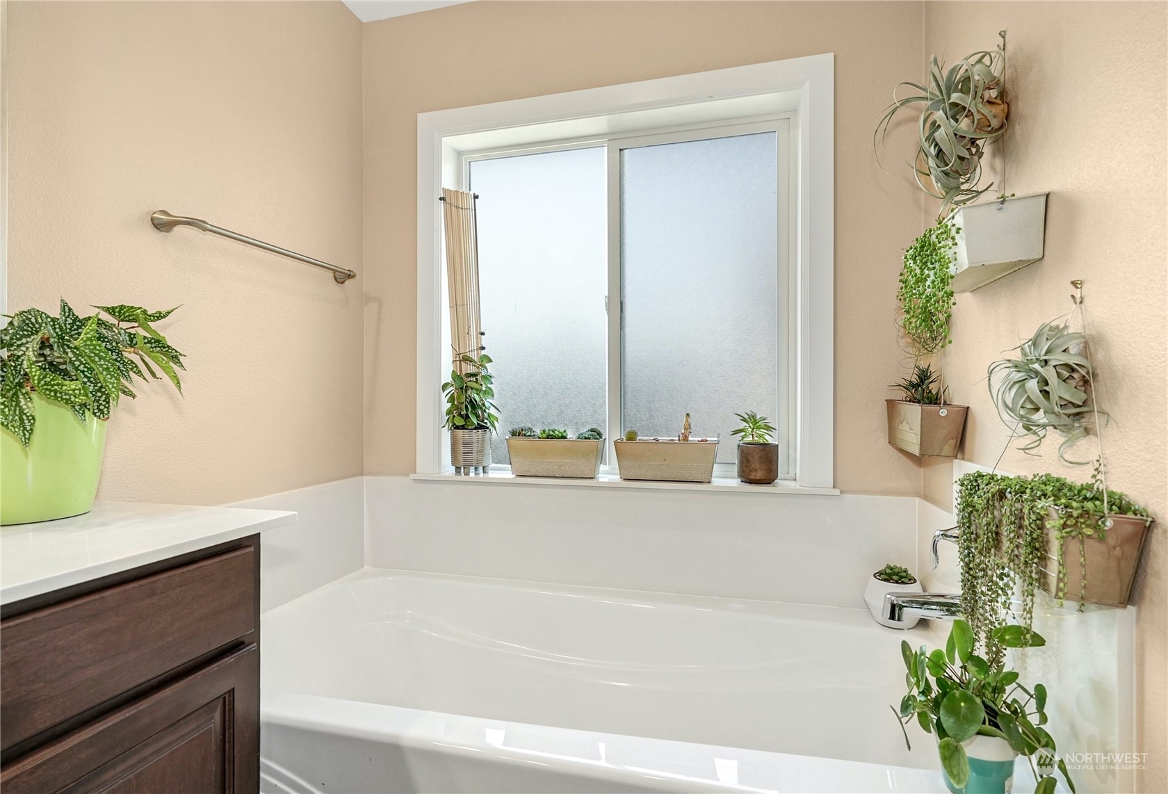 4012 174th Street Southeast Bothell, WA 98012 - Photo 20 of 36 a bath tub sitting in a bathroom next to a window