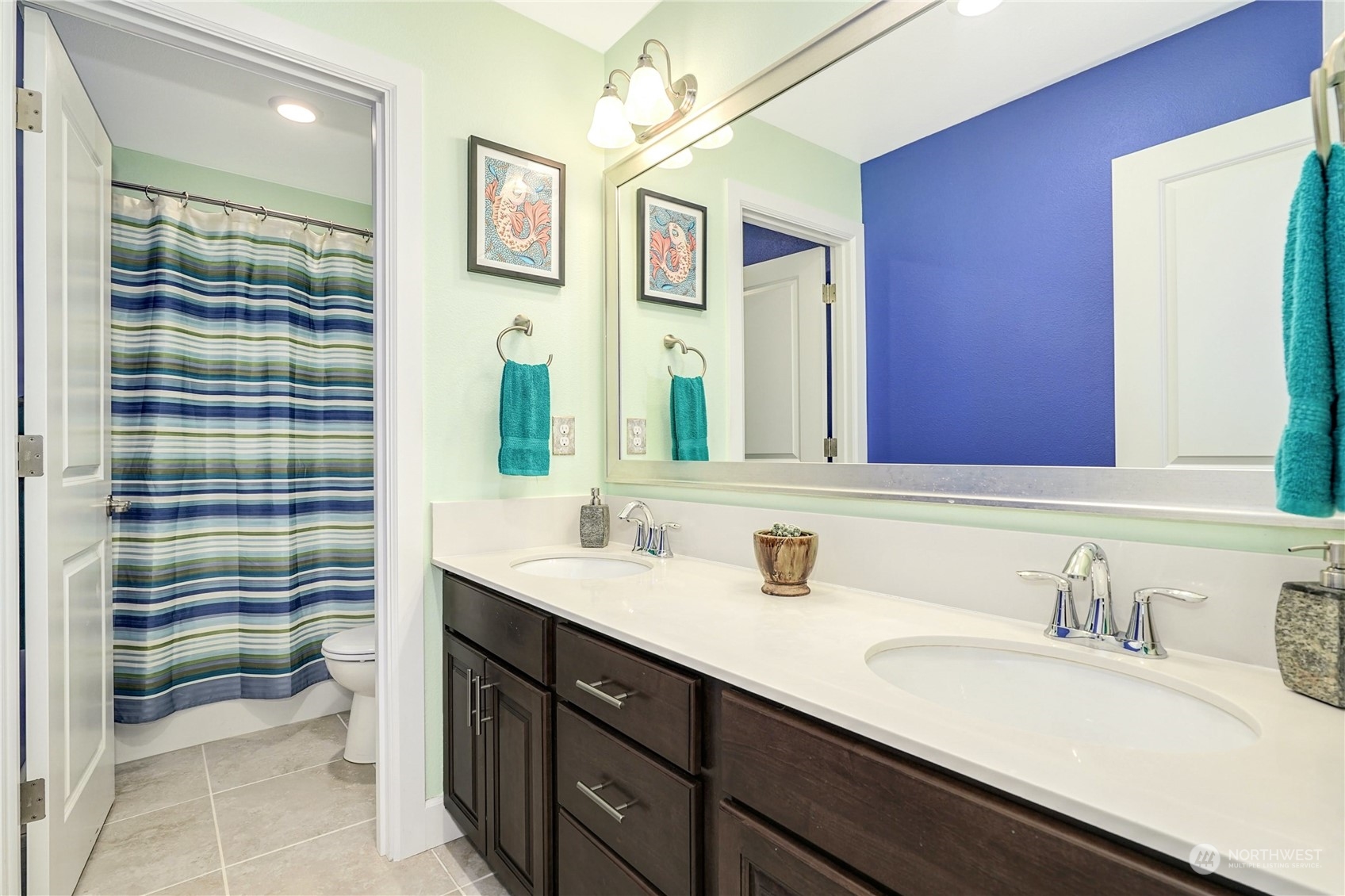 4012 174th Street Southeast Bothell, WA 98012 - Photo 26 of 36 a bathroom with a sink a toilet and a mirror