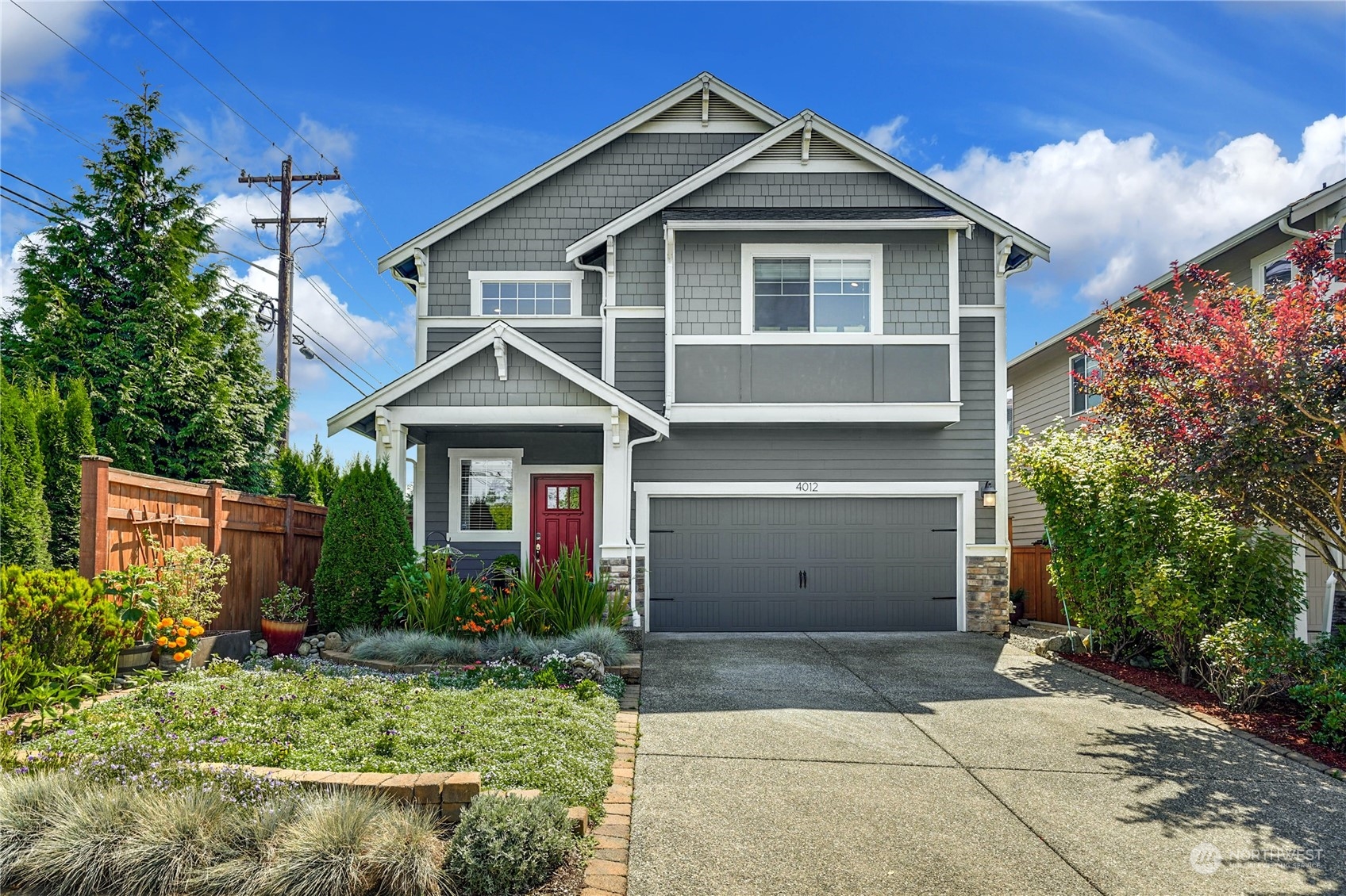 4012 174th Street Southeast Bothell, WA 98012 - Photo 33 of 36 a view of a house with yard and plants