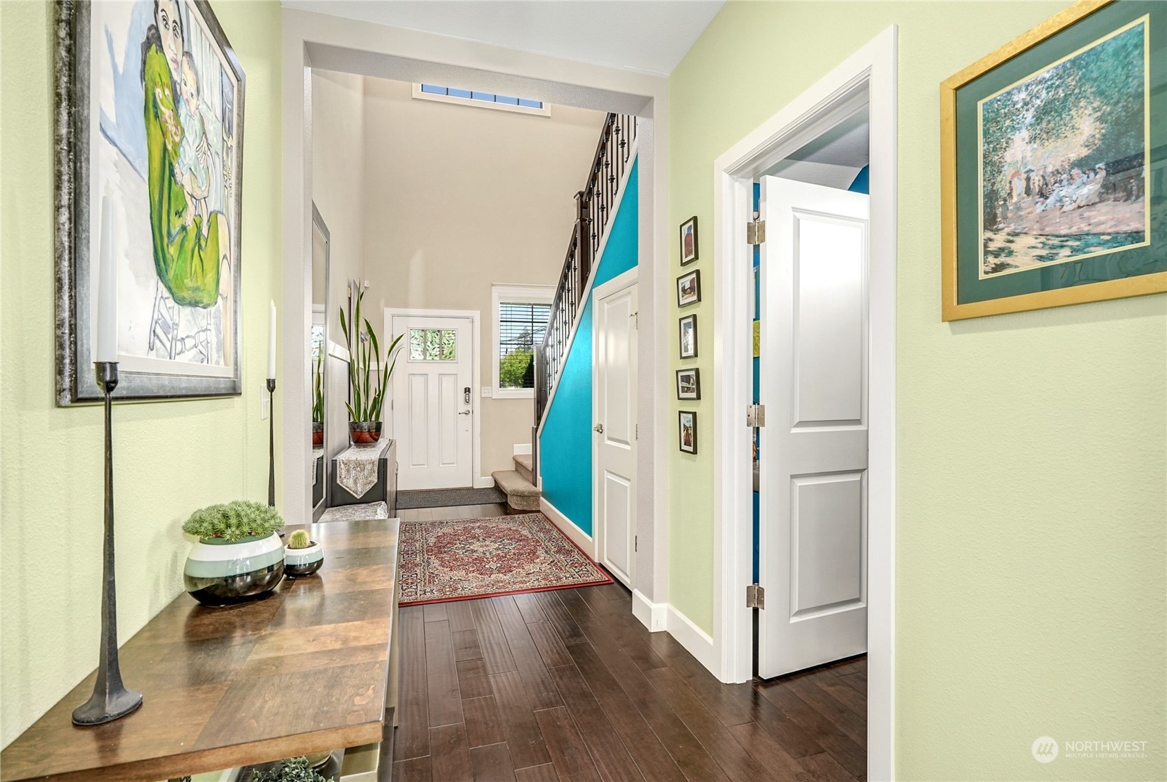 4012 174th Street Southeast Bothell, WA 98012 - Photo 4 of 36 a view of a hallway with furniture and a painting on the wall