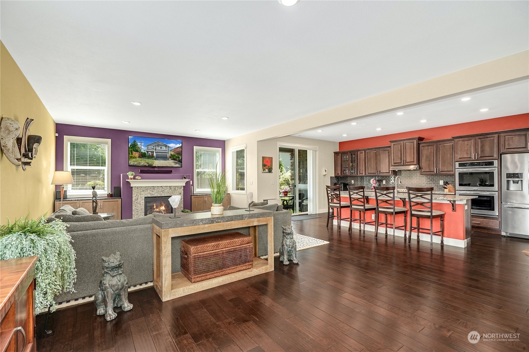 4012 174th Street Southeast Bothell, WA 98012 - Photo 6 of 36 a kitchen with a table chairs stove and wooden floor