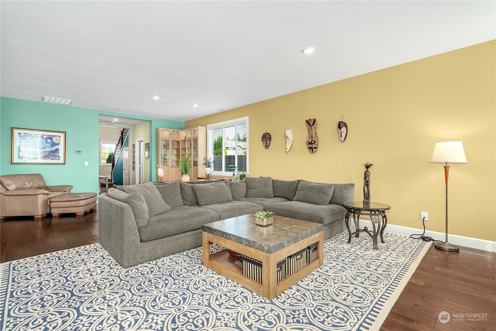 4012 174th Street Southeast Bothell, WA 98012 - Photo 9 of 36 a living room with furniture and a rug