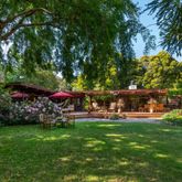 a view of a park with large trees