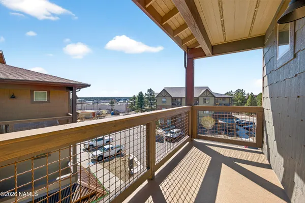 a view of a balcony with furniture