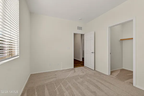 a bathroom with a granite countertop sink toilet a large mirror a bathtub and shower
