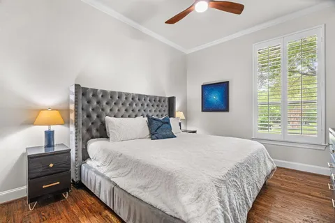 a bedroom with a bed and a lamp